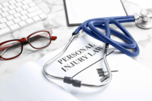 Personal injury lawyer paperwork, stethoscope, and glasses - Ohio personal injury lawyer